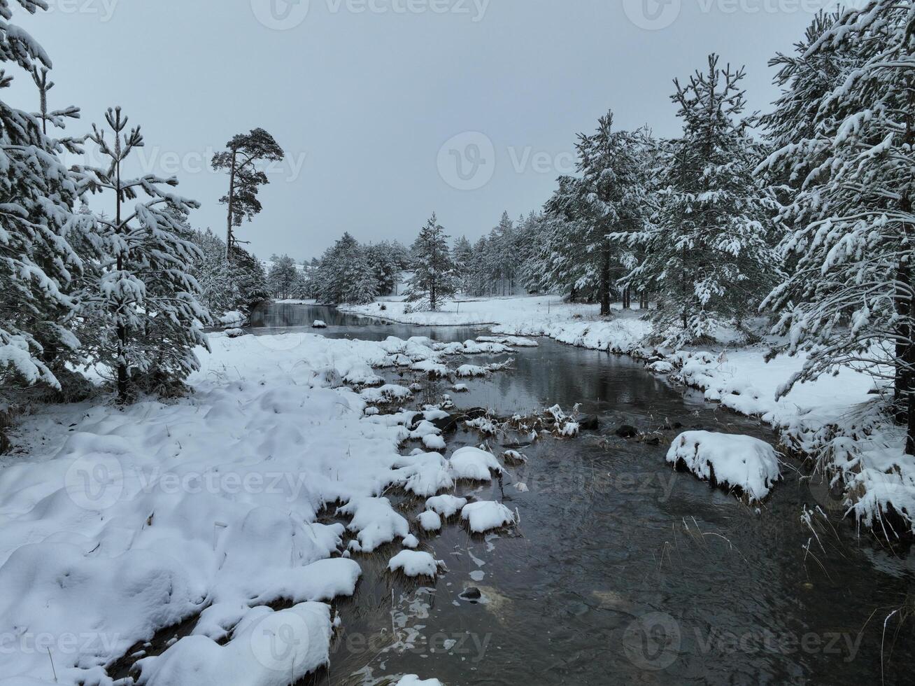 Amazing Cinematic Aerial View On Freezing River. Aerial View Flight Above Frozen Creek Scenic View Of Nature photo