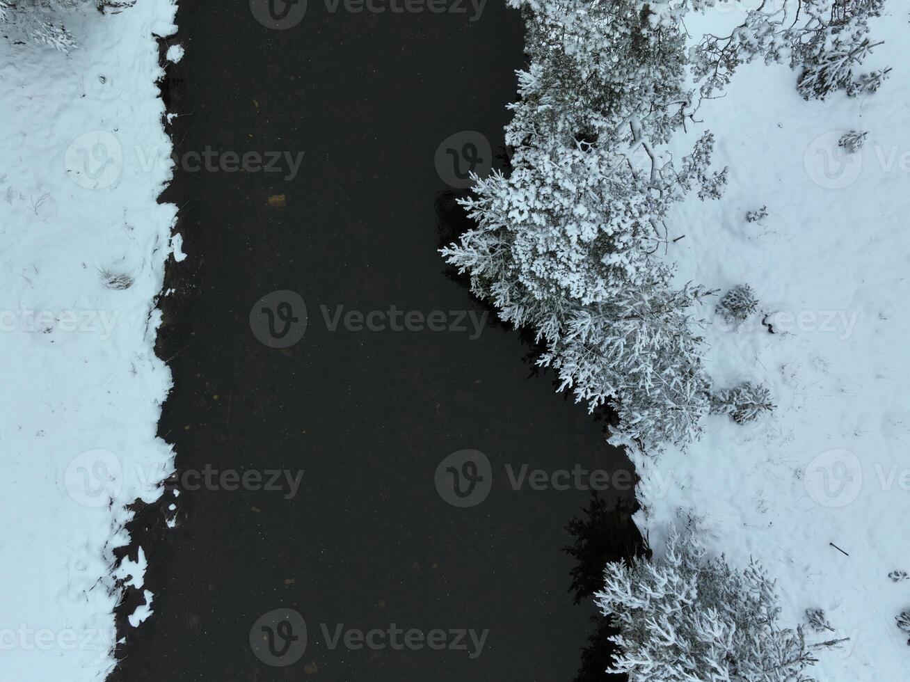 Amazing Cinematic Aerial View On Freezing River. Aerial View Flight Above Frozen Creek Scenic View Of Nature photo