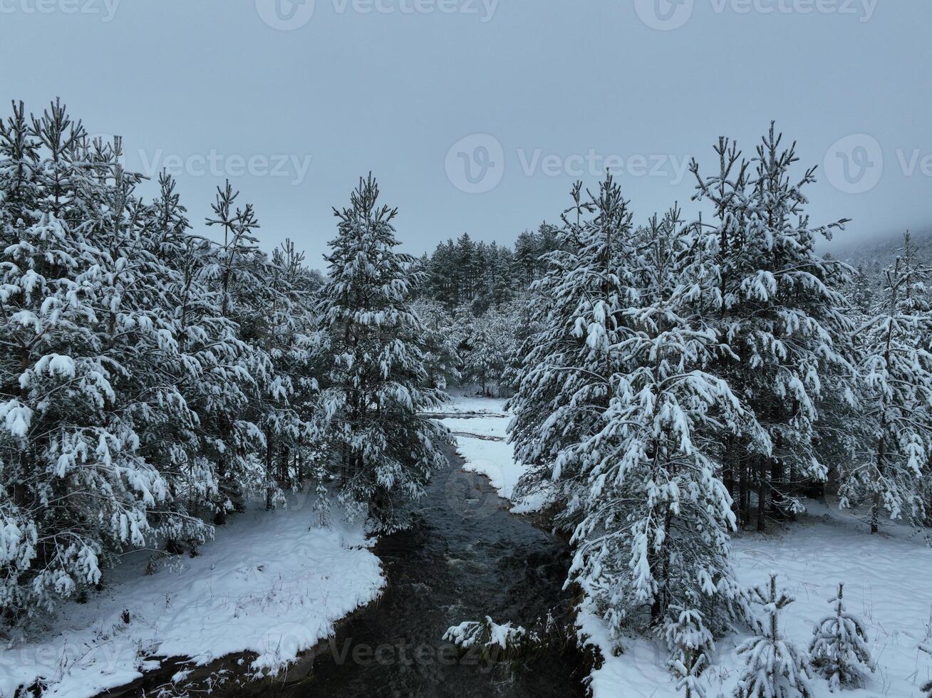 Amazing Cinematic Aerial View On Freezing River. Aerial View Flight Above Frozen Creek Scenic View Of Nature photo