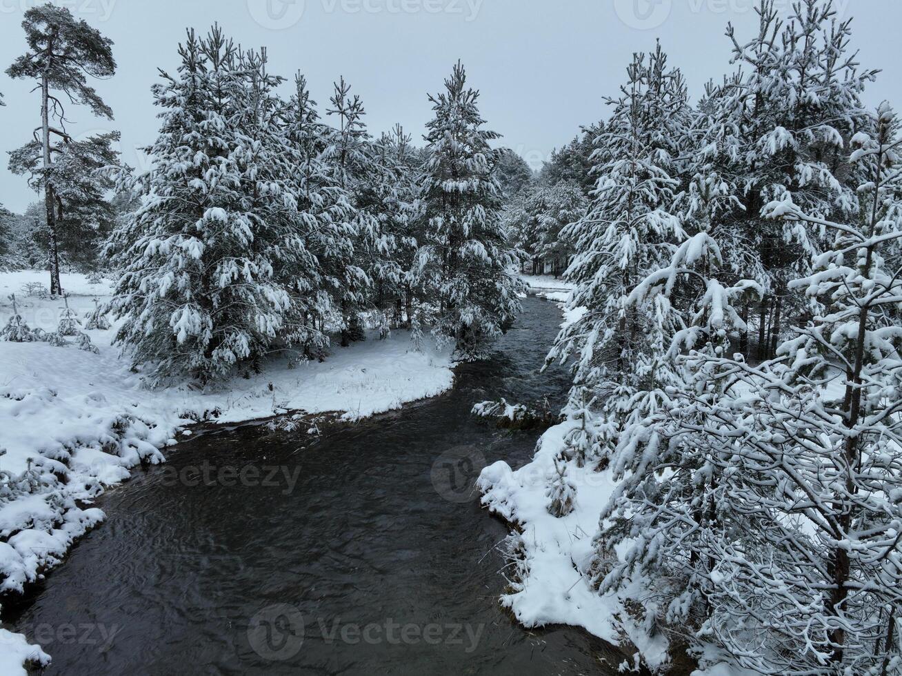Amazing Cinematic Aerial View On Freezing River. Aerial View Flight Above Frozen Creek Scenic View Of Nature photo