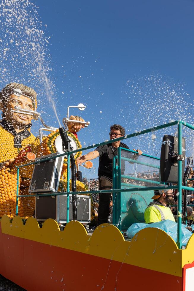 Menton, France-February 12, 2023 t raditional carnival parade of Lemon Festival in colorful costumes photo