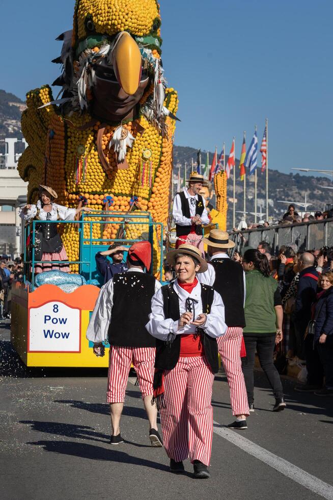 Menton, France-February 12, 2023 traditional carnival parade of Lemon Festival in colorful costumes photo