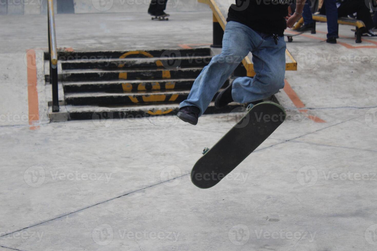 An asian man doing tricks on a skateboard. Indonesia - Medan, 21 June 2024 photo
