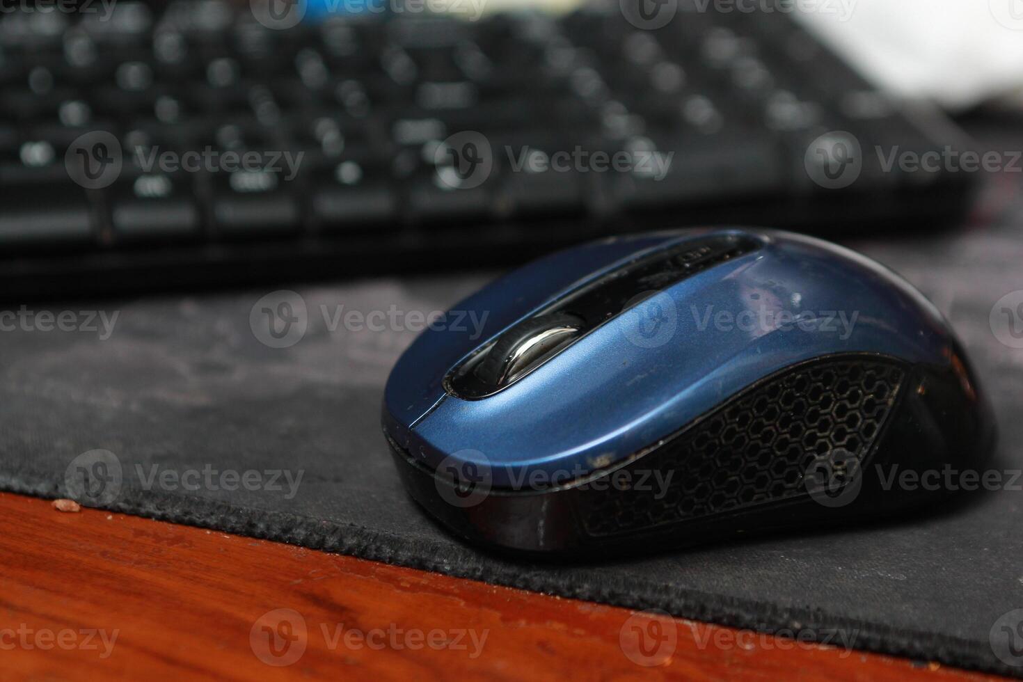 an old blue mouse on a mouse pad photo