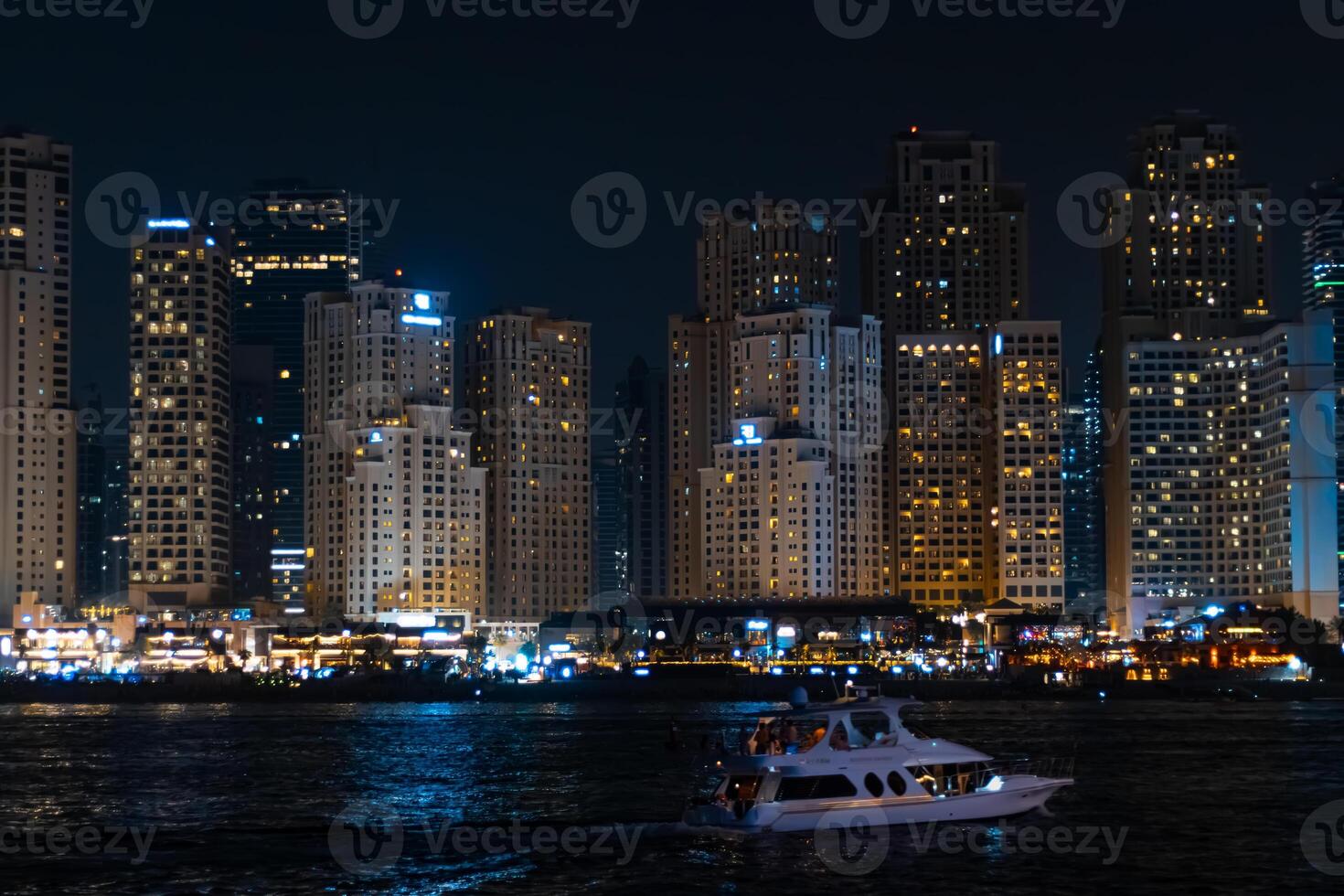 View of modern skyscrapers in Jumeirah beach residence on November in Dubai, JBR - artificial canal city, carved along a 3 km stretch of Persian Gulf shoreline. photo