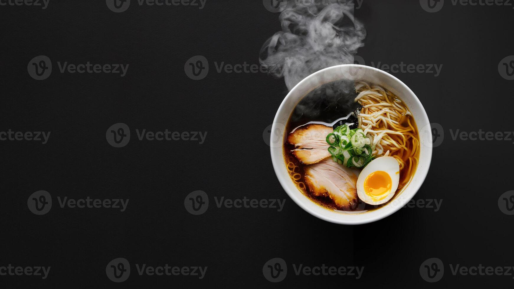 A Bowl of Shoyu Ramen Overflowing with Tender Noodles, Green Onions, and the Perfectly Soft-Boiled Egg photo