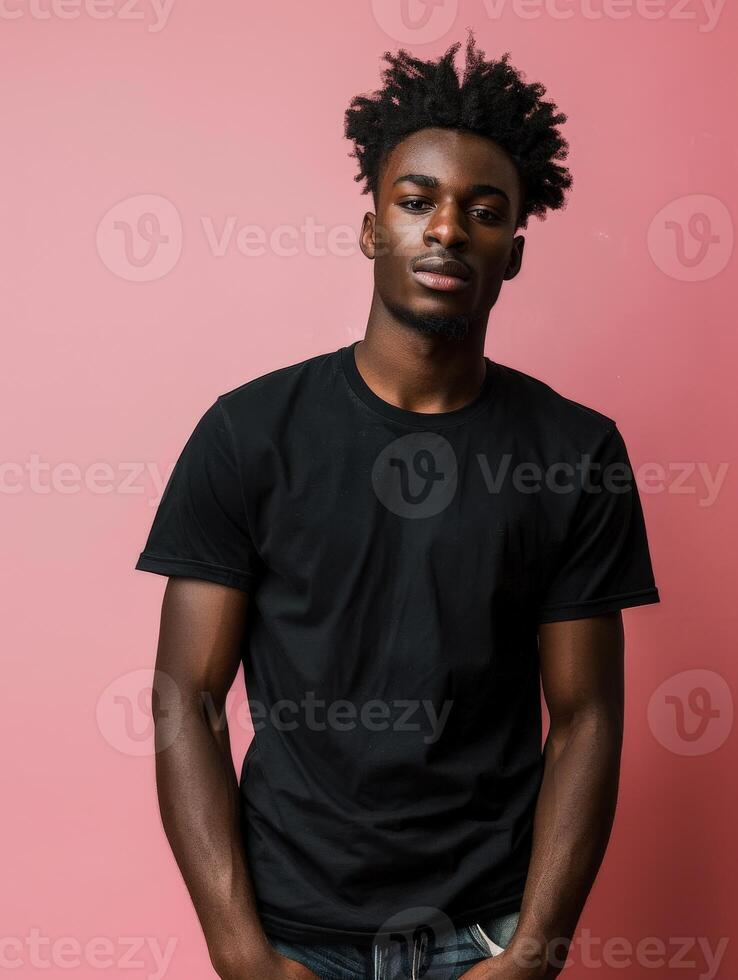 Black T-Shirt Model Posing Against Pink Background photo