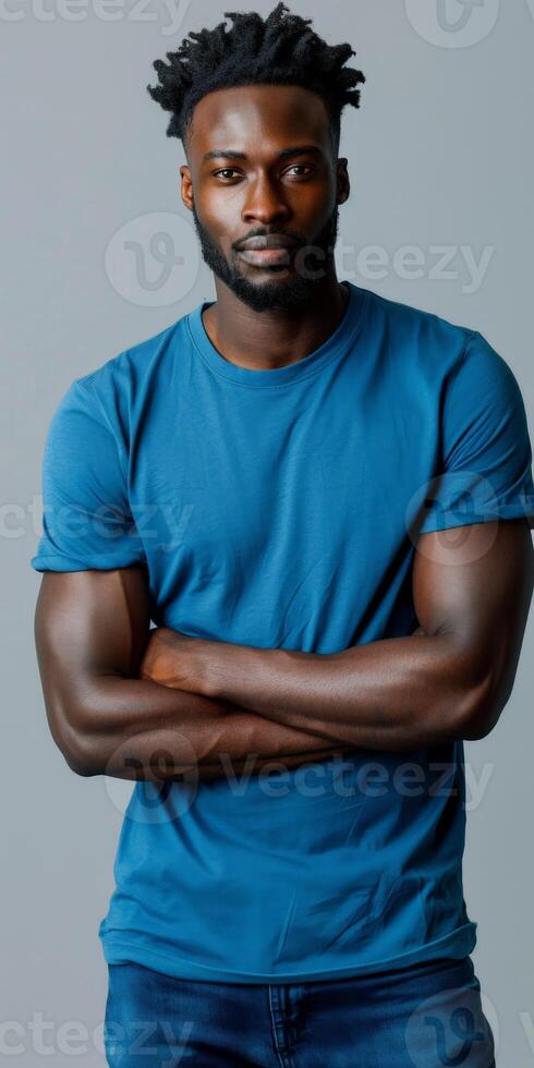 Man With Dreadlocks Wearing Blue T-Shirt and Jeans photo