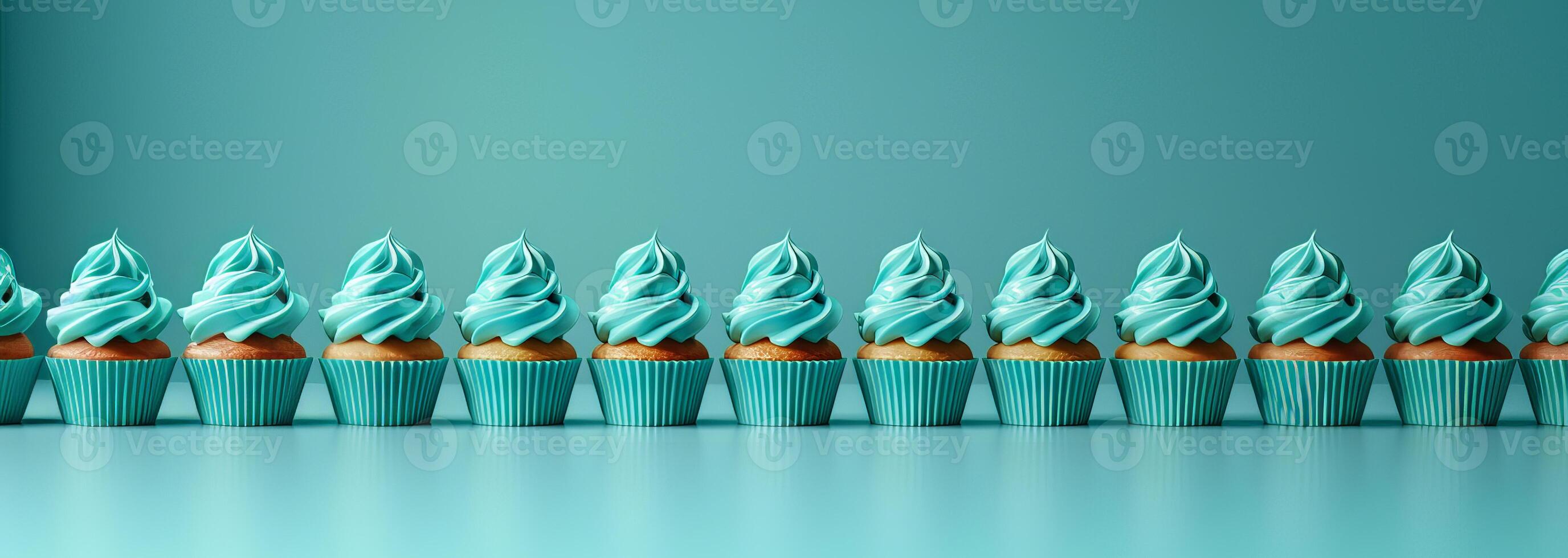 Row plain monochrome light turquoise frosted cupcakes simple blue background, minimalism, copy space photo