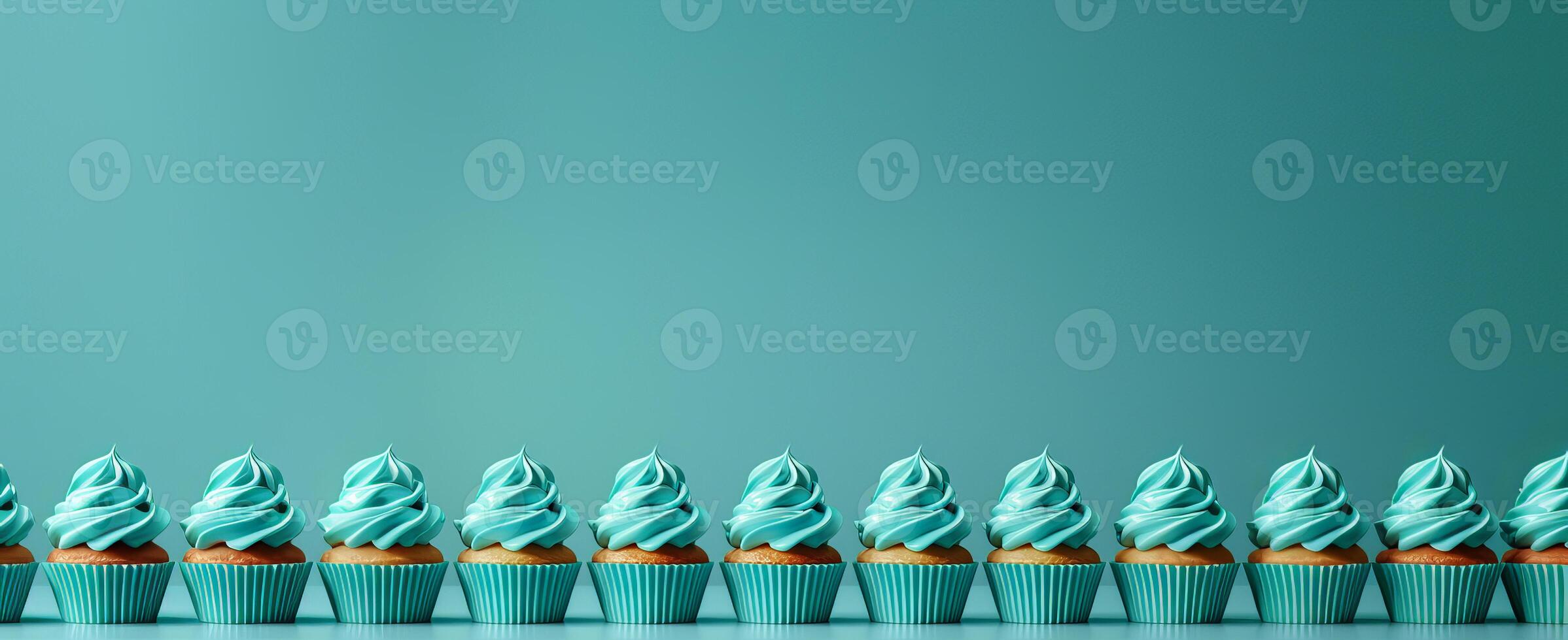 Row plain monochrome light turquoise frosted cupcakes simple blue background, minimalism, copy space photo