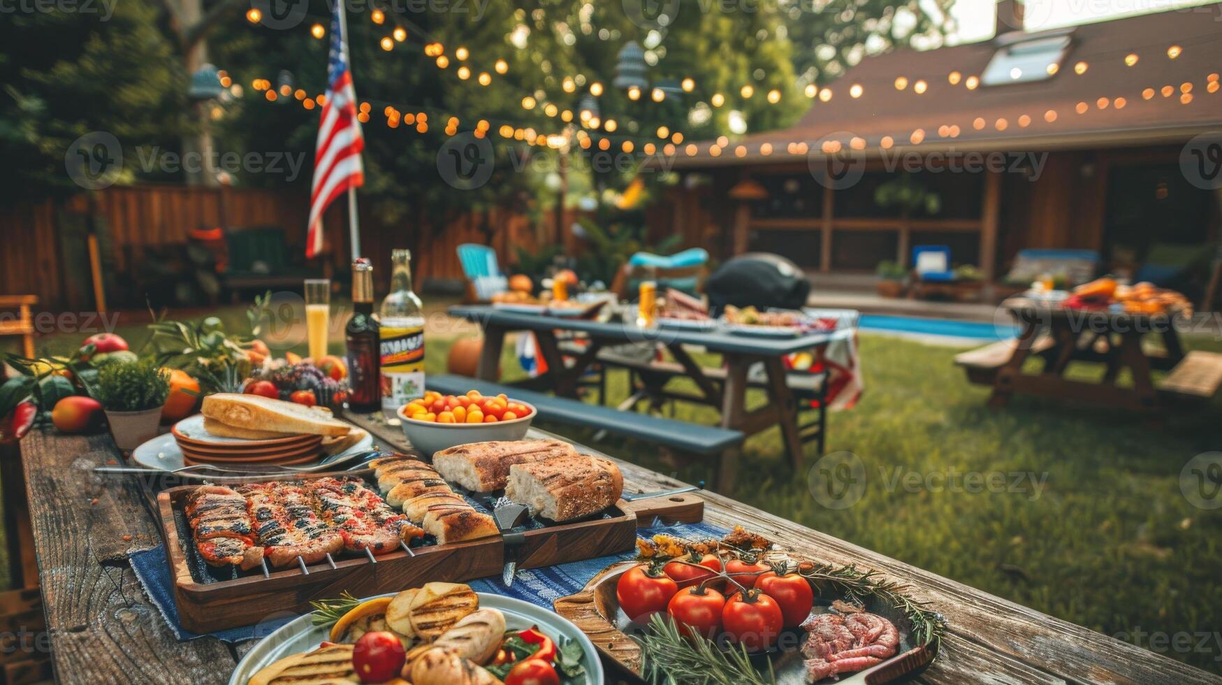 Barbecue party with grilled food in backyard with American flags. 4th of July, USA Independence Day photo