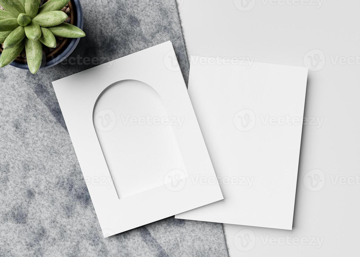 An invitation card with an arch-shaped hole, perfect for wedding invitation mockups and more. photo