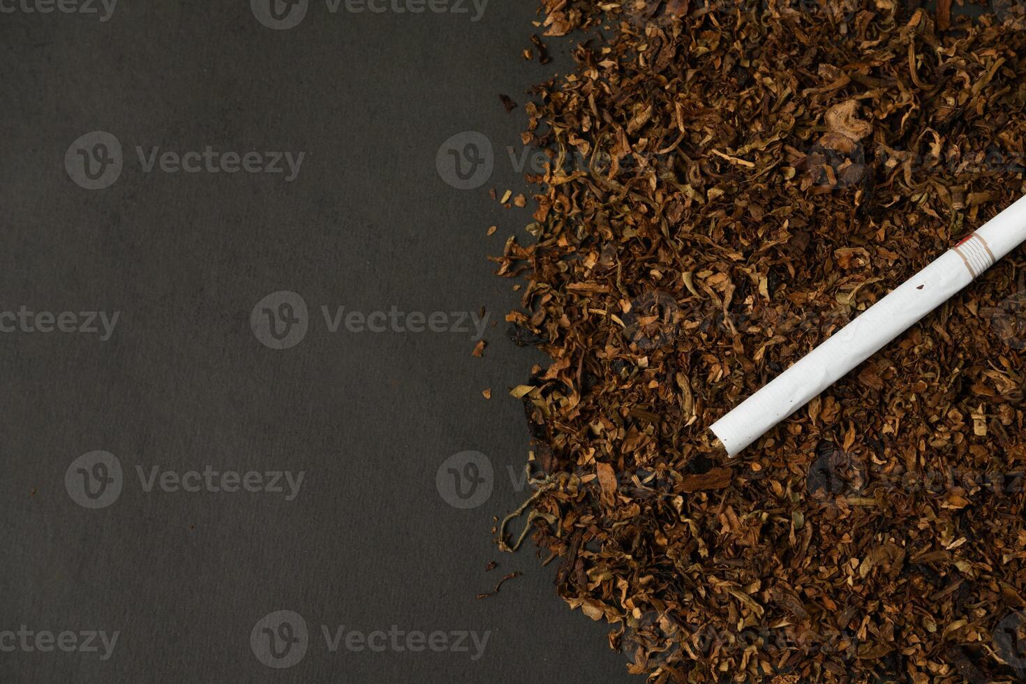 fine tobacco with a cigarette on top photo
