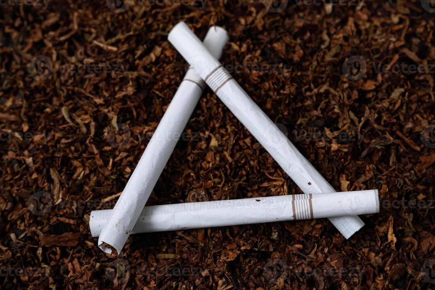 fine tobacco with a cigarettes on top photo