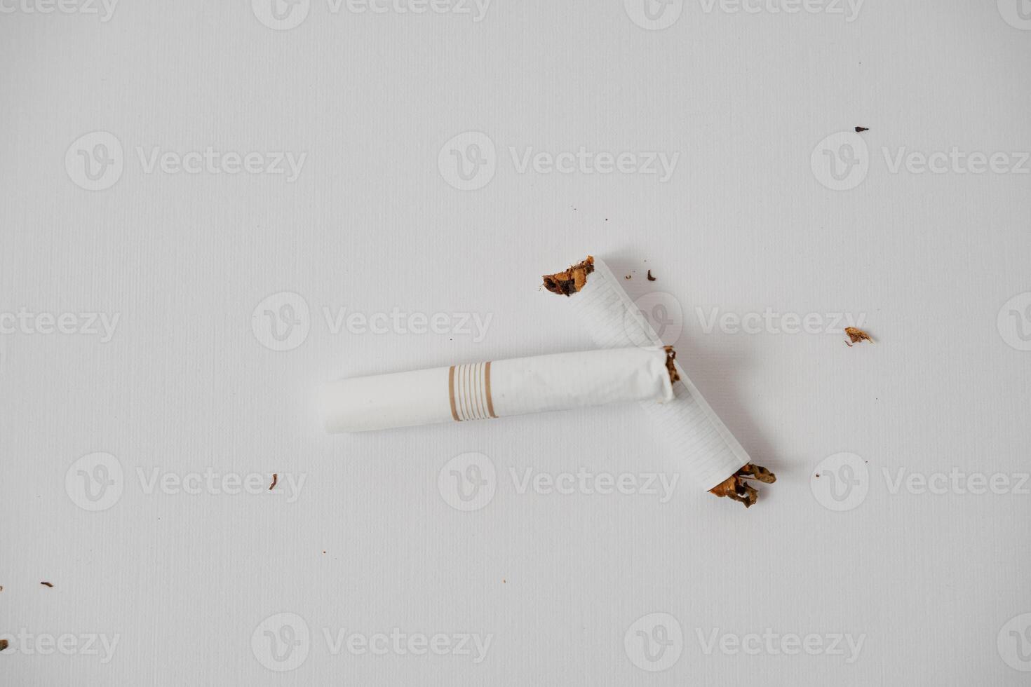 a broken cigarette on a white background photo