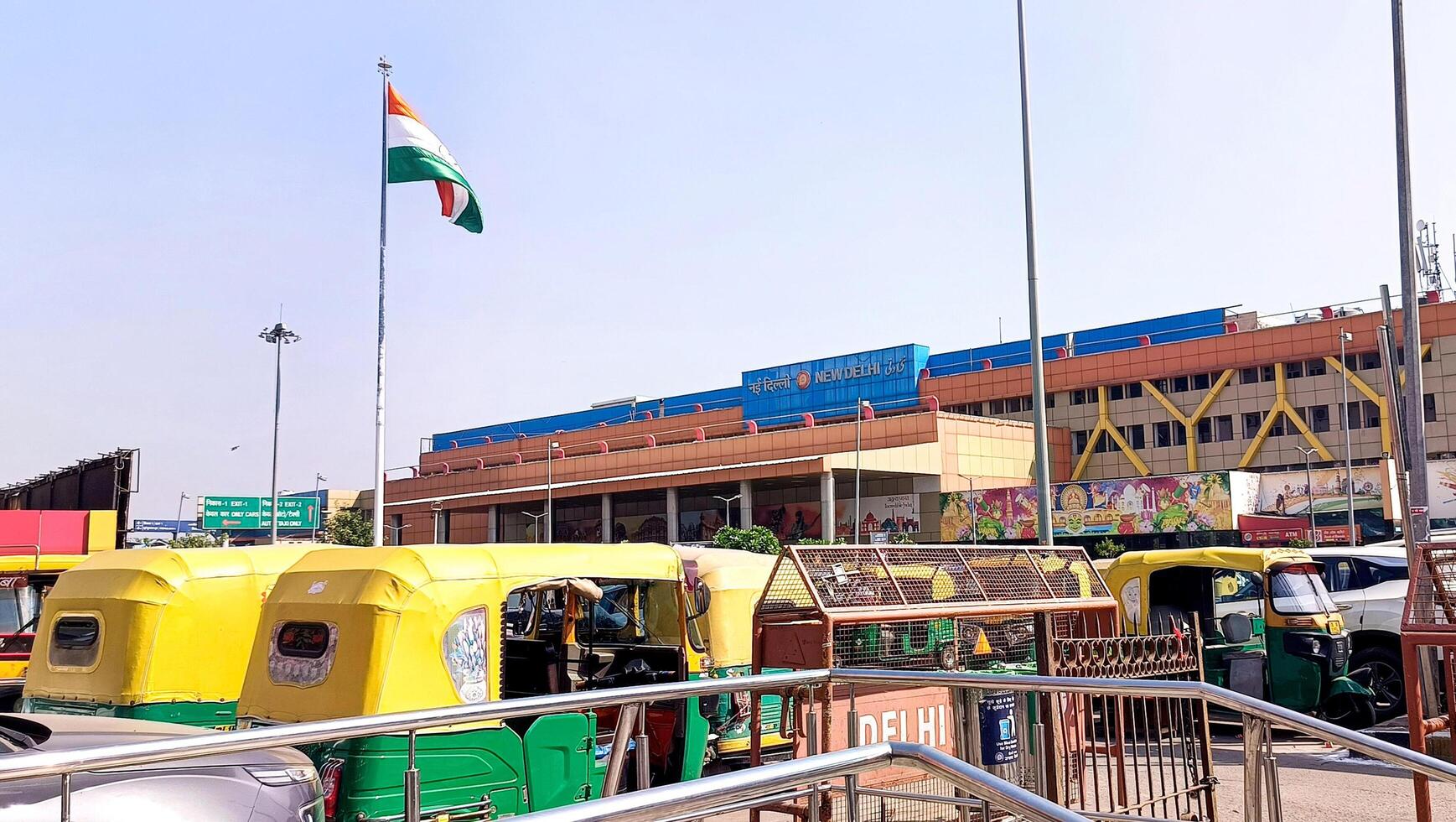 Indian flag waving outside New Delhi Railway Station photo