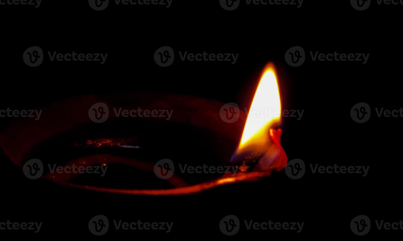 Traditional oil lamp on dark background with copy space. photo