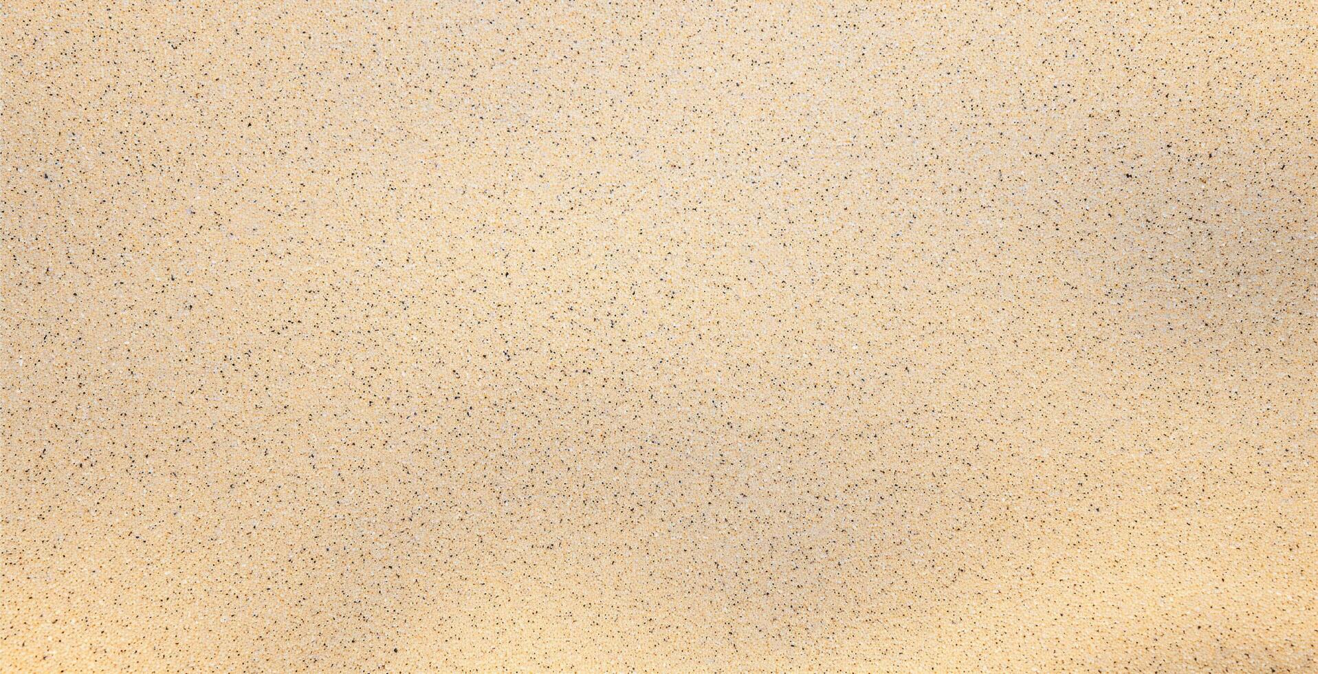 Natural yellow sand on the beach background photo