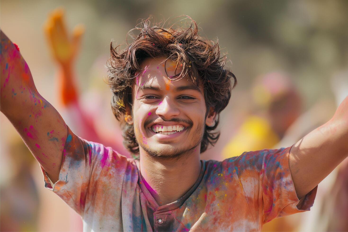 Happy young man enjoying while playing holi photo