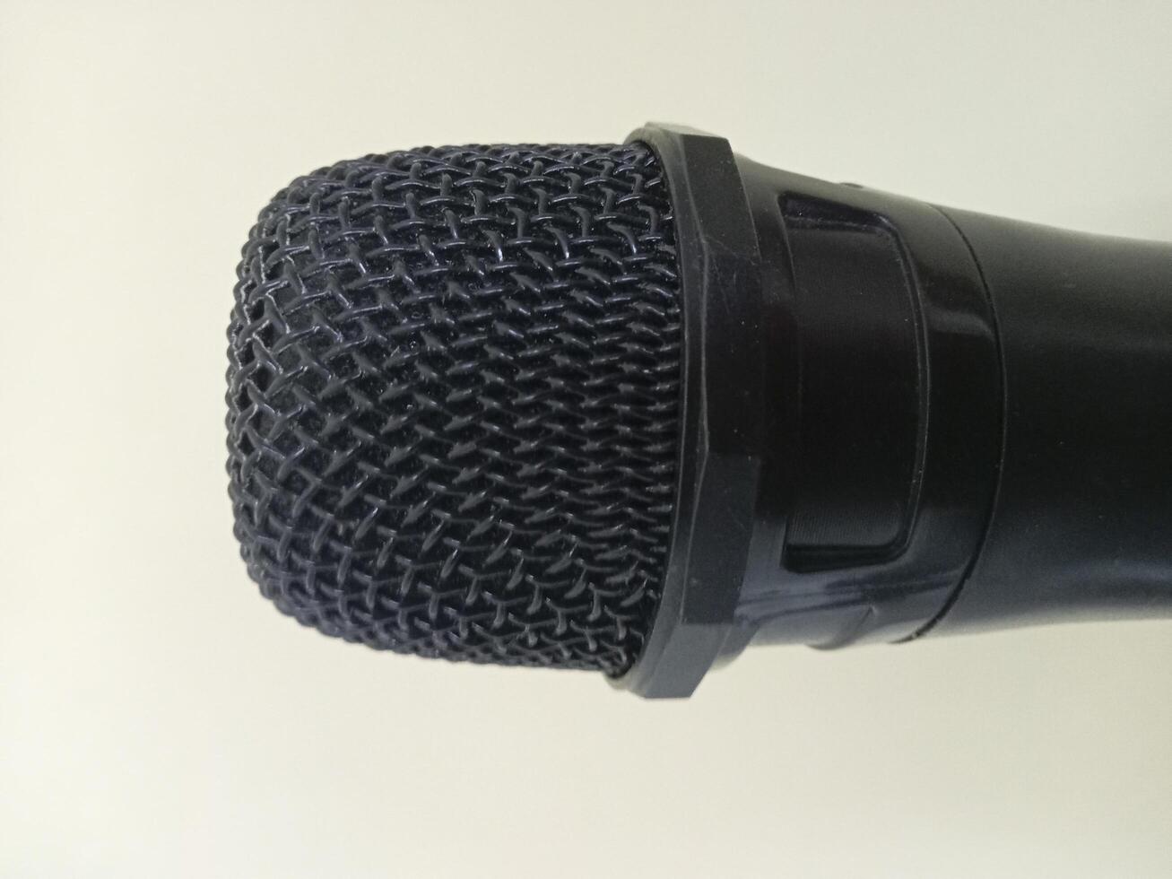 a close up of a microphone with a black cover photo