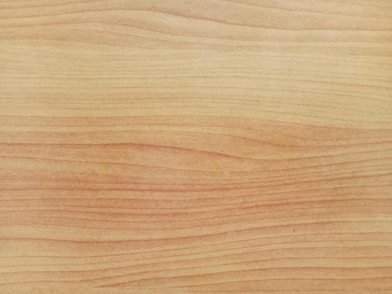 a close up of a wooden surface with a light brown stain photo
