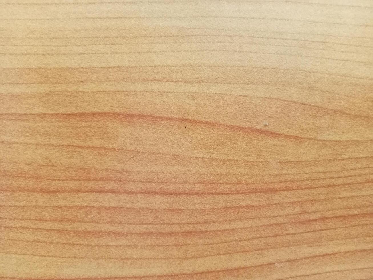 a close up of a wooden surface with a light brown stain photo