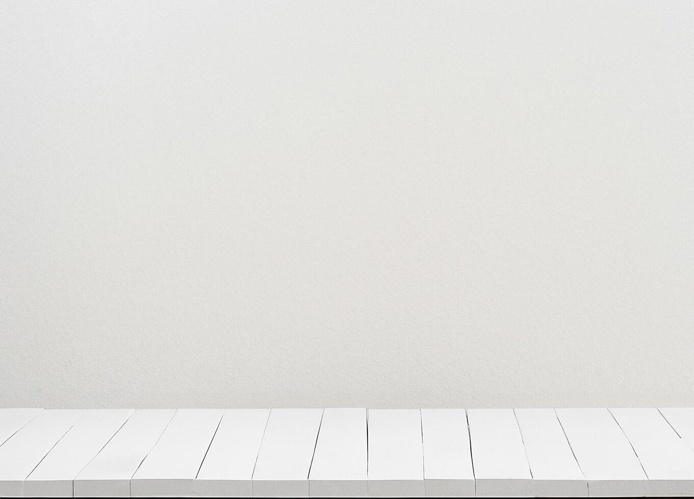 Wooden white table with white wall photo