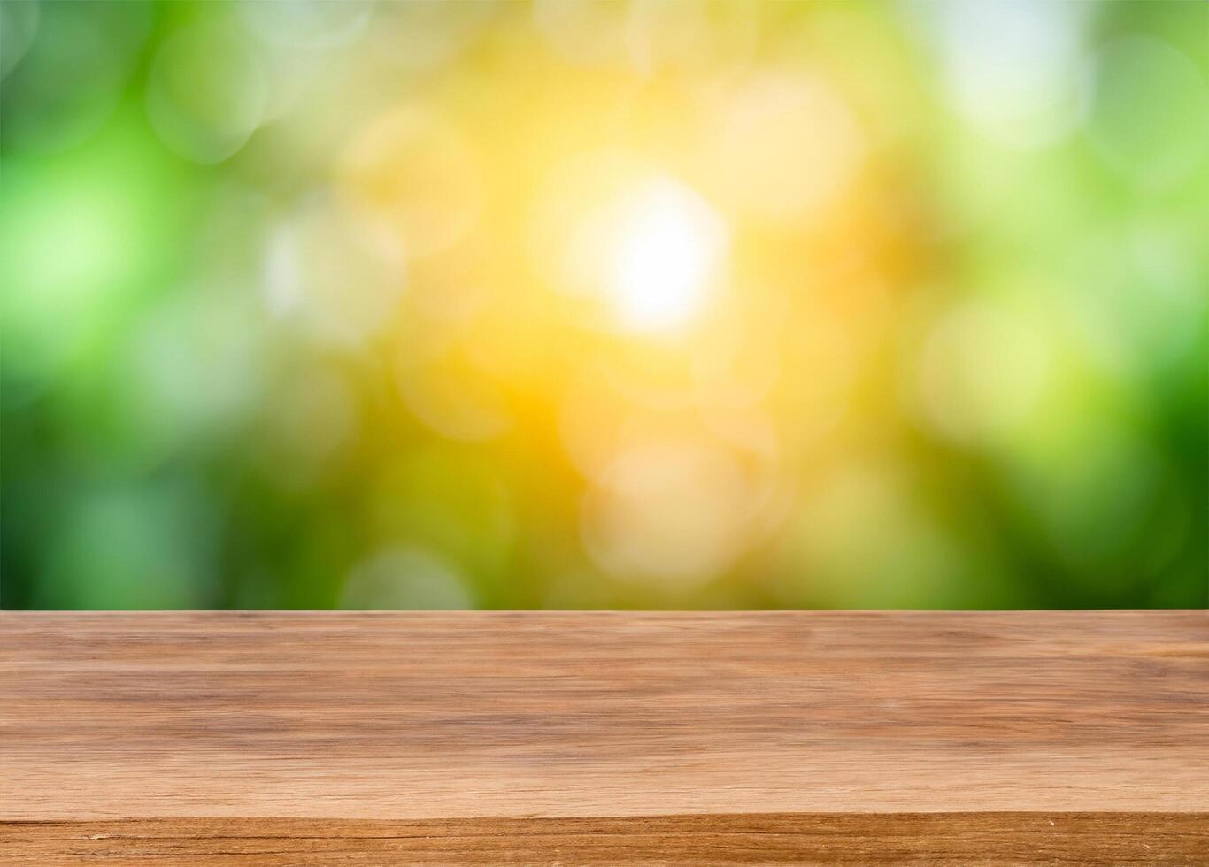 Wood table for product display with green tree background photo