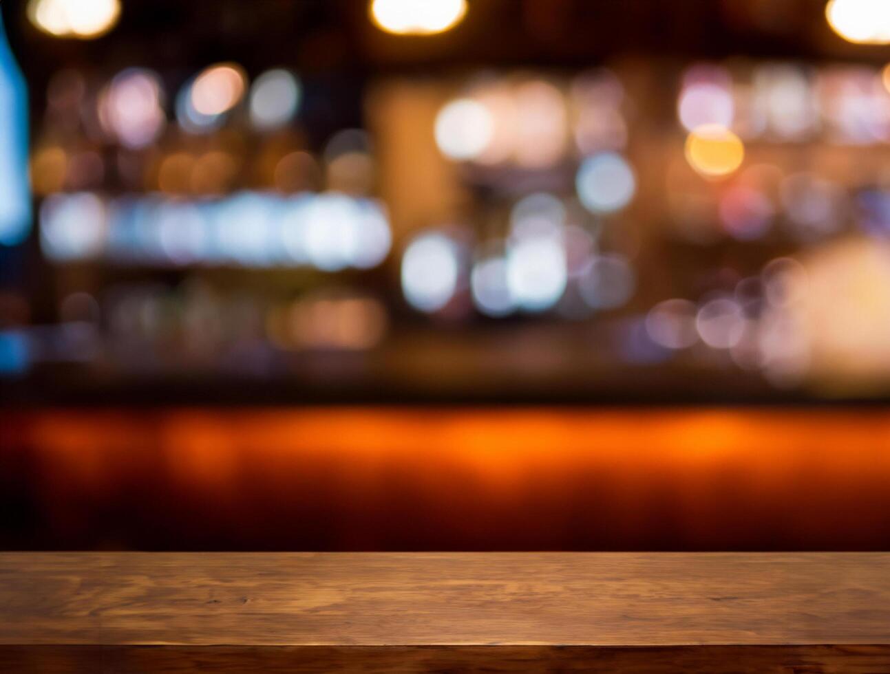 Empty wooden bar counter with blurred photo