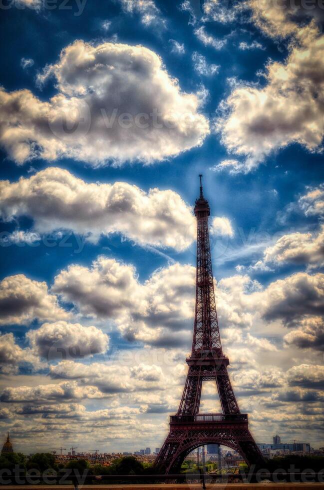 the Eiffel Tower is a metal tower completed in 1889 for the Universal Exhibition and then became the most famous monument in Paris. Here with the background of a cloudy sky photo