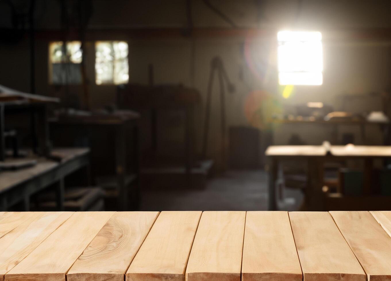 Wooden table with blurred dark shadows and natural sun light workshop interior photo