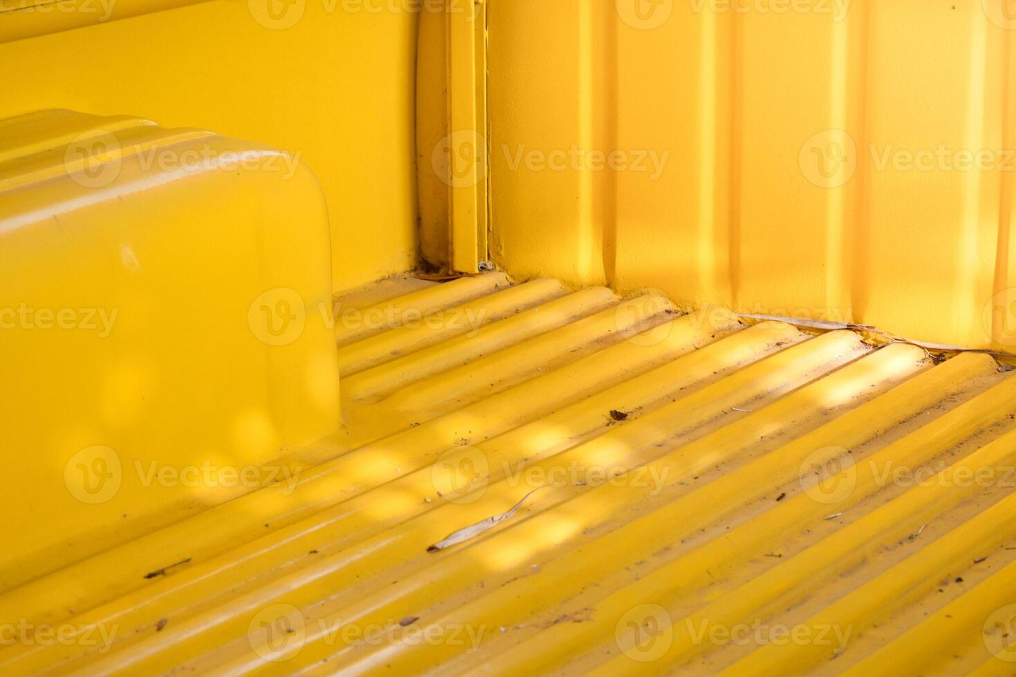 Yellow metal sheet on the back of the car,car surface on yellow metallic background and soft sunlight, charming vintage classic car. photo