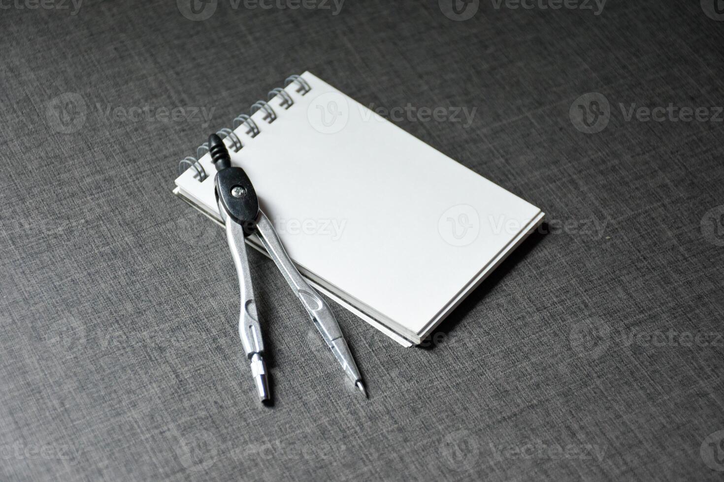 Blank notebook and dividers on dark table wooden pattern background,Blank black cover template with copy space for design,notebook isolated on dark background,concept of design and business. photo