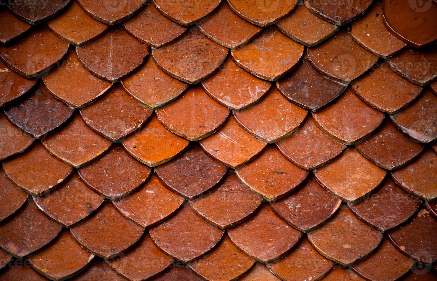 Roof tile seamless pattern for house covering in red,Close up Detail of Perfect roof red tiles texture,Red roof thai temple background image. photo