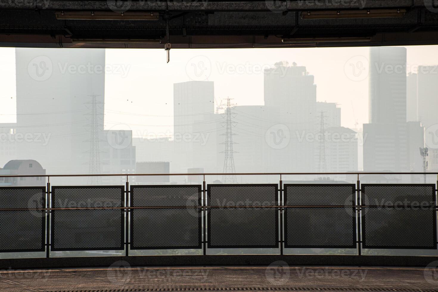 Photographs from the building show views of Bangkok and buildings shrouded in fog and dust p.m 2.5. Panoramic of cityscape Bangkok with buildings and high voltage poles. photo