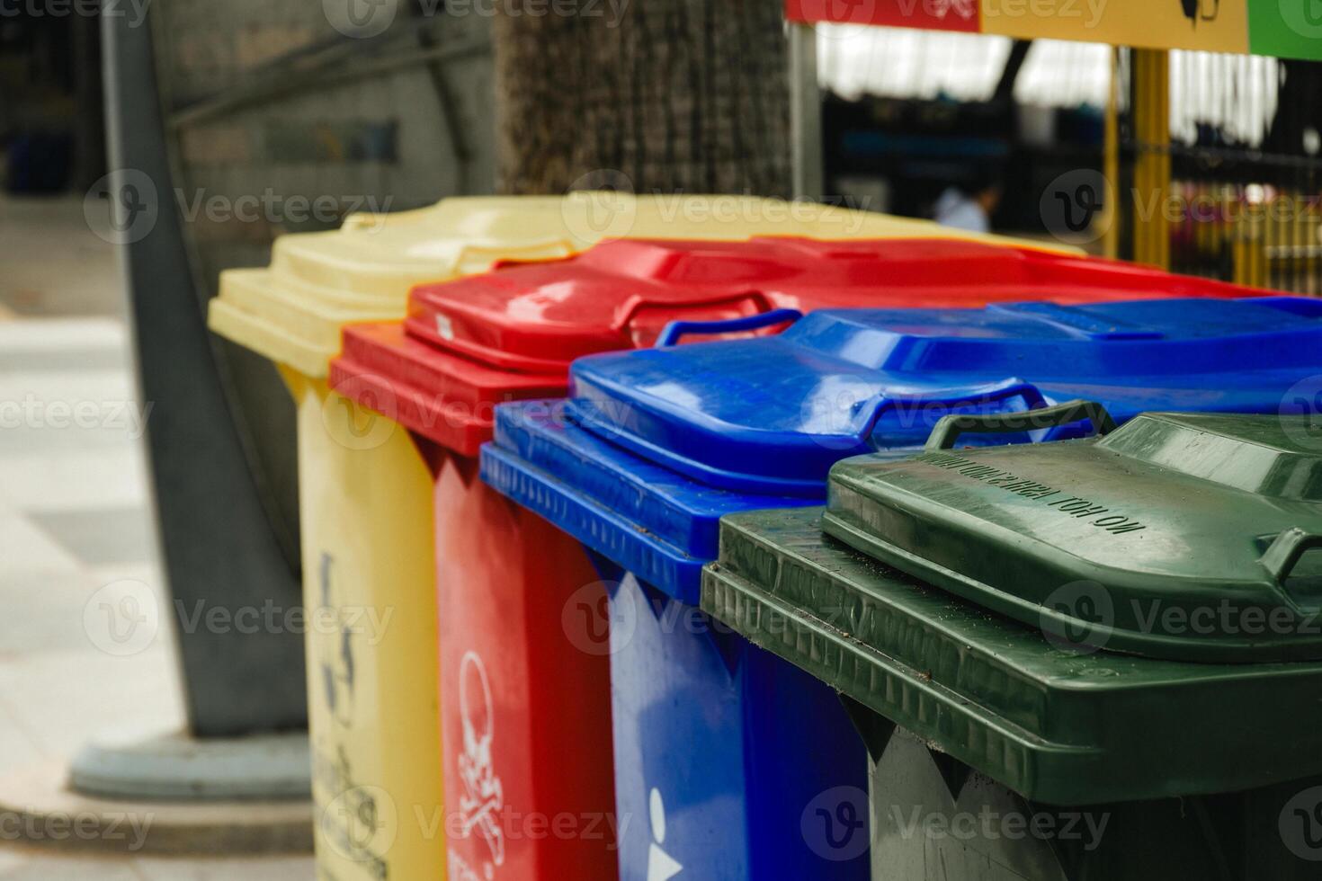 Outdoor public trash can used for garbage disposal and garbage separation for environmental protection and cleanliness concept in vintage tone background. photo