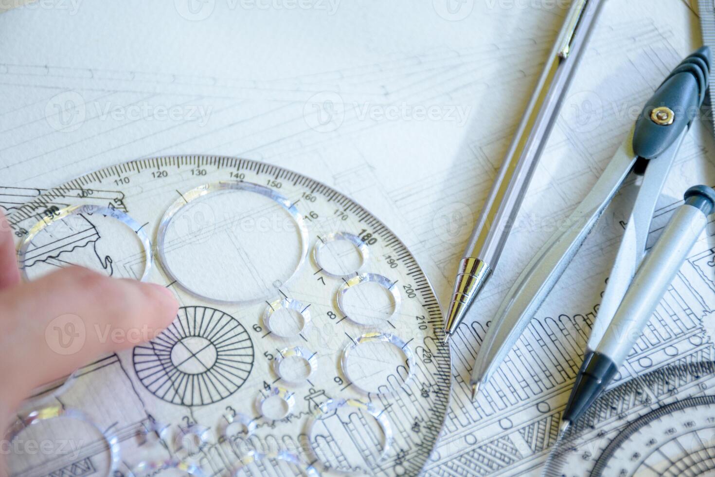 Design or drafting tool for engineers designing home construction and interior decoration and includes a pencil and a concept circle ruler for architectural concepts and planning. photo