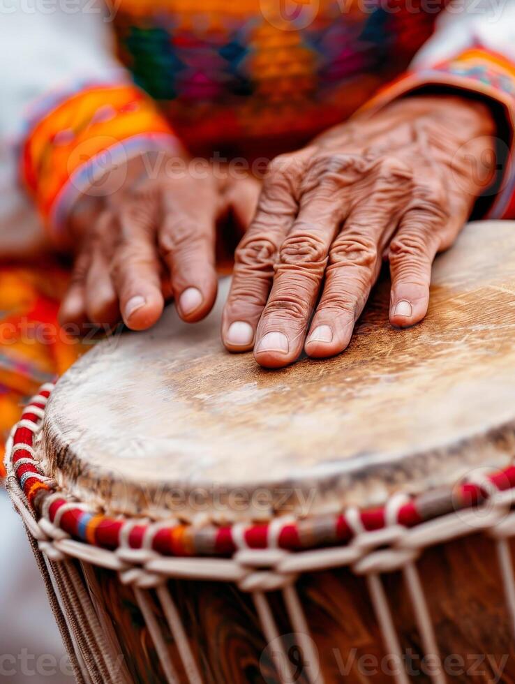 Closeup of hands playing traditional african drum. photo