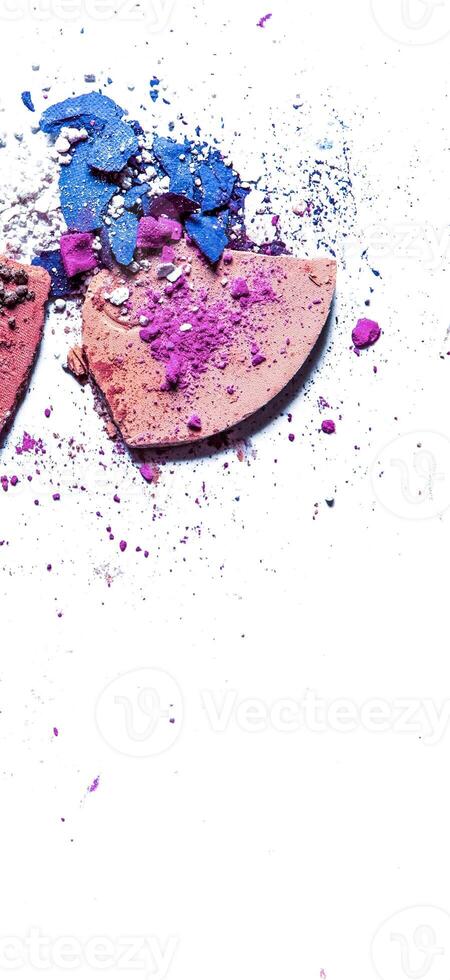 Crushed eyeshadow palette and powder close-up isolated on white background photo
