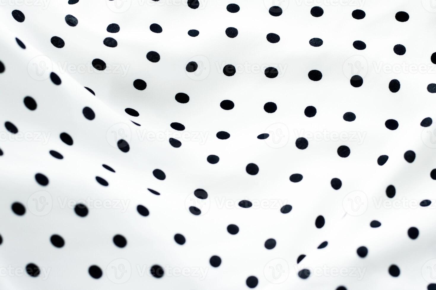 Classic polka dot textile background texture, black dots on white luxury fabric design pattern photo
