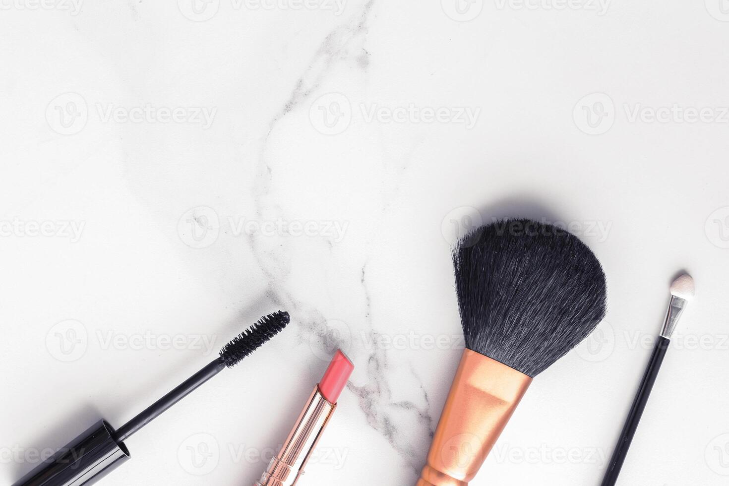 Make-up and cosmetics flatlay on marble photo