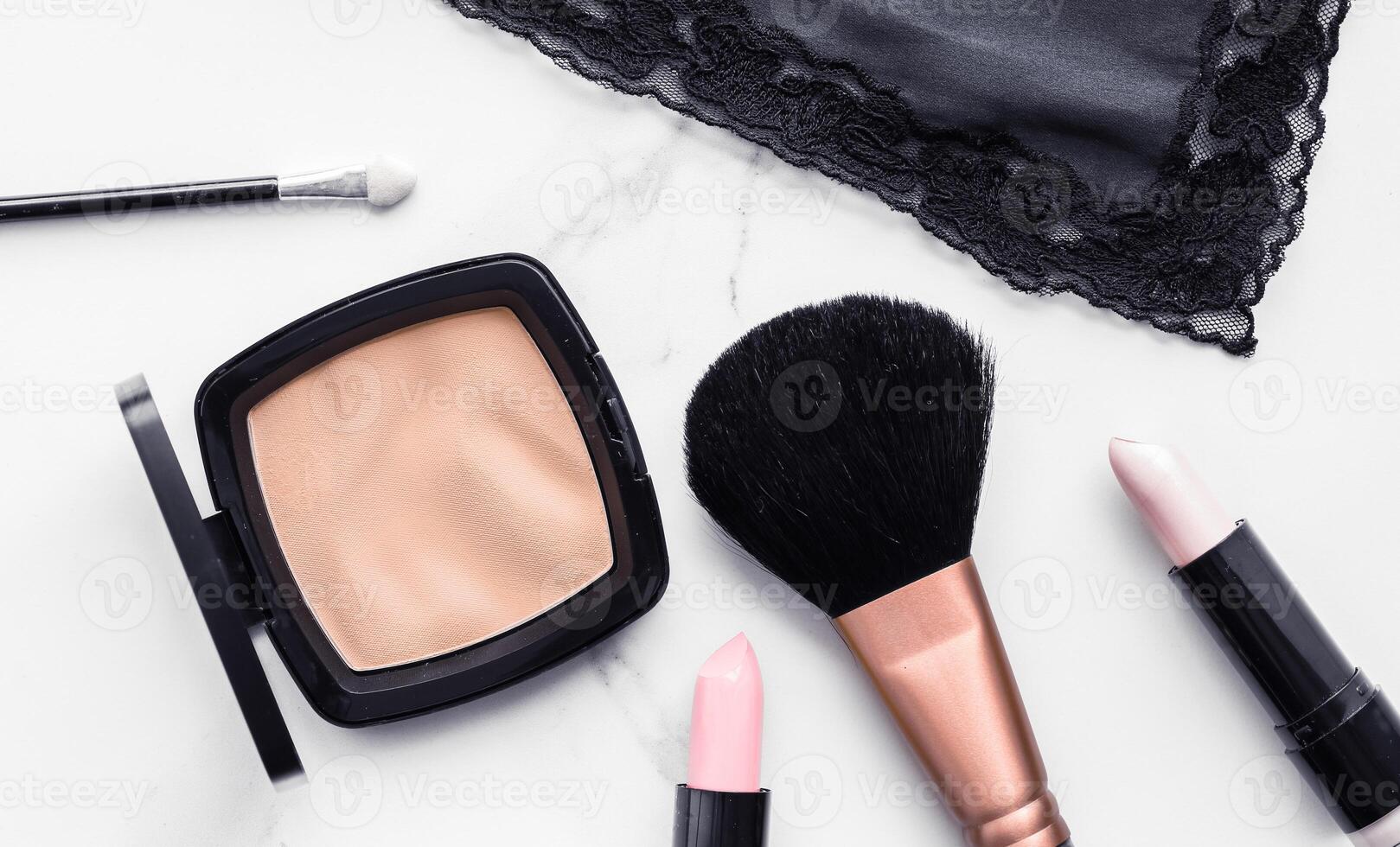 Make-up and cosmetics flatlay on marble photo