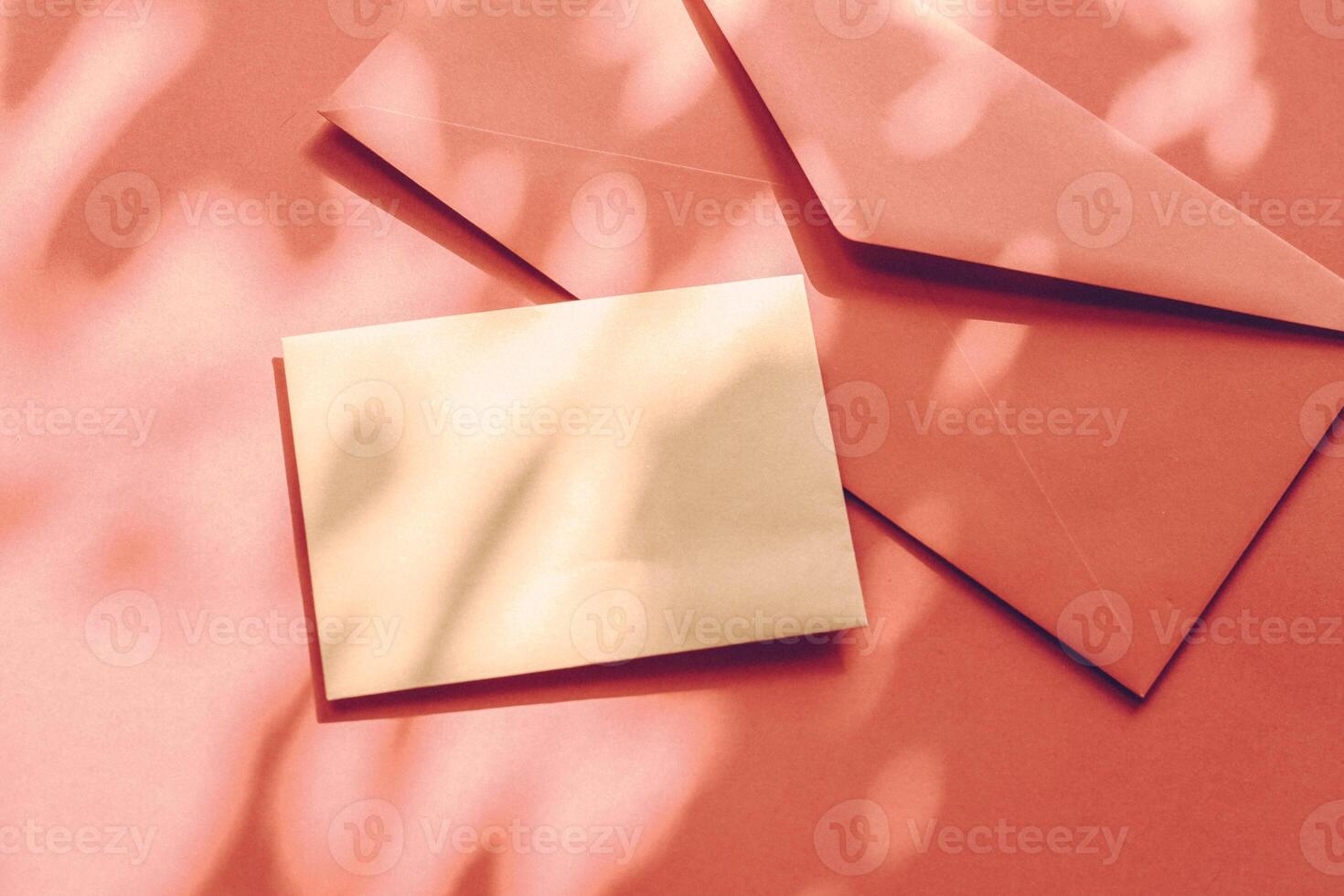 Beauty brand identity as flatlay mockup design, business card and letter for online luxury branding on orange shadow background photo