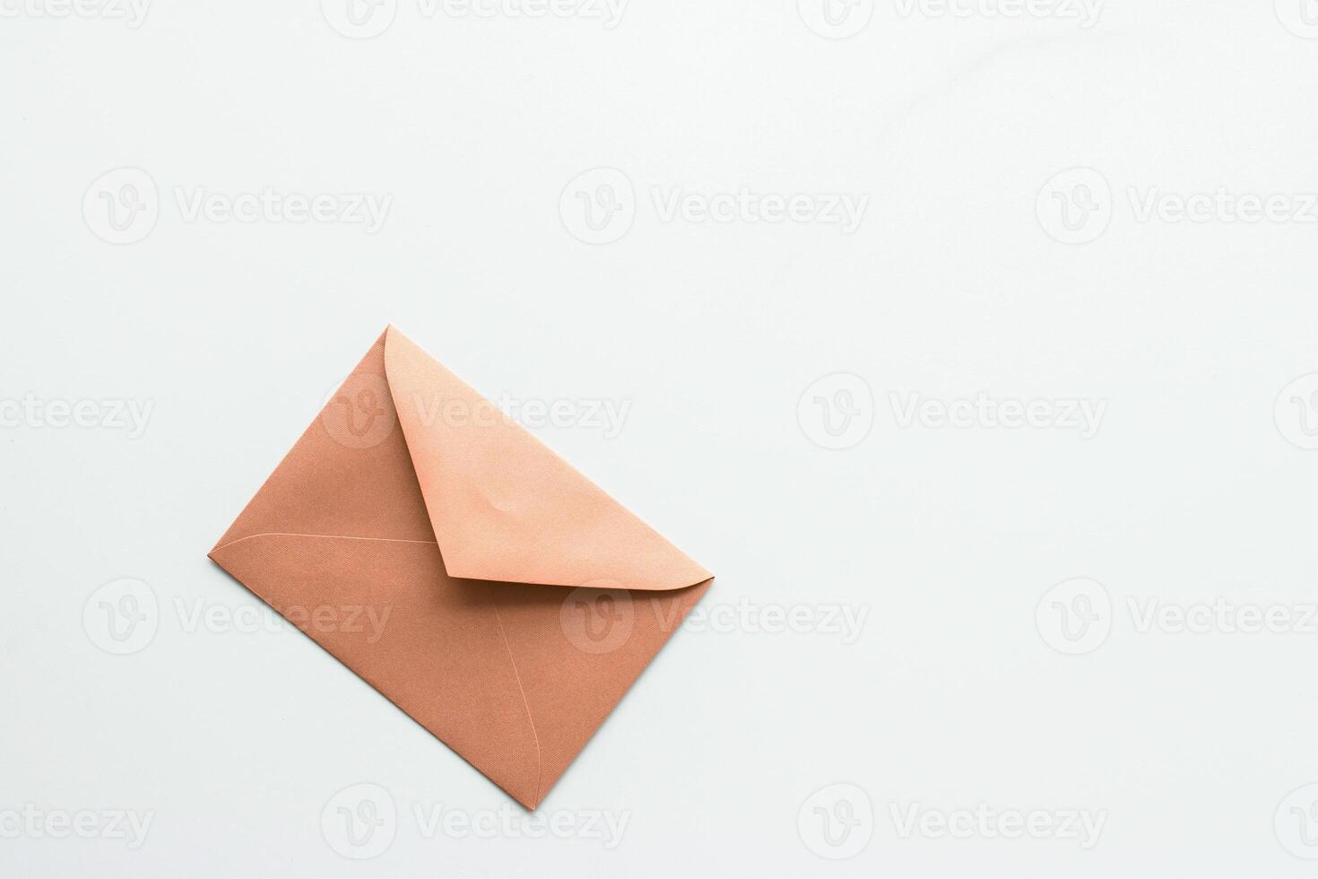 Blank paper envelopes on marble flatlay background, holiday mail letter or post card message design photo