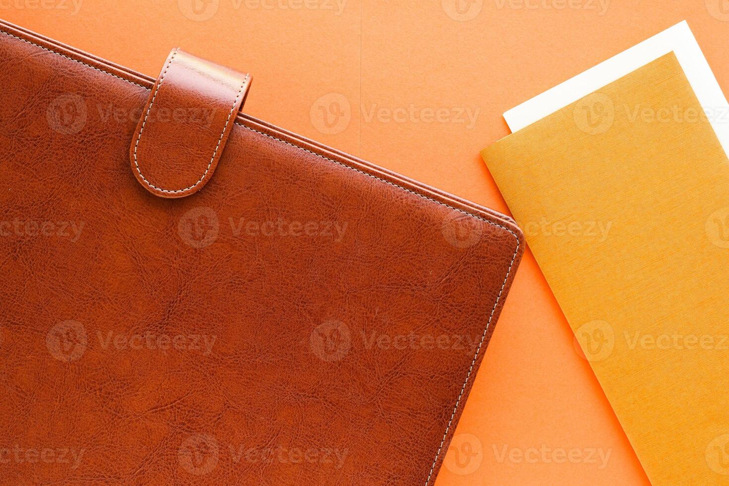 Luxury business brown brief-case on the office table desk, flatlay photo