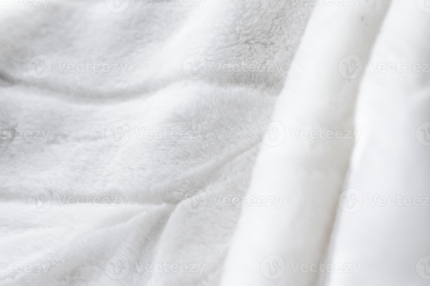 Luxury white fur coat texture background, artificial fabric detail photo