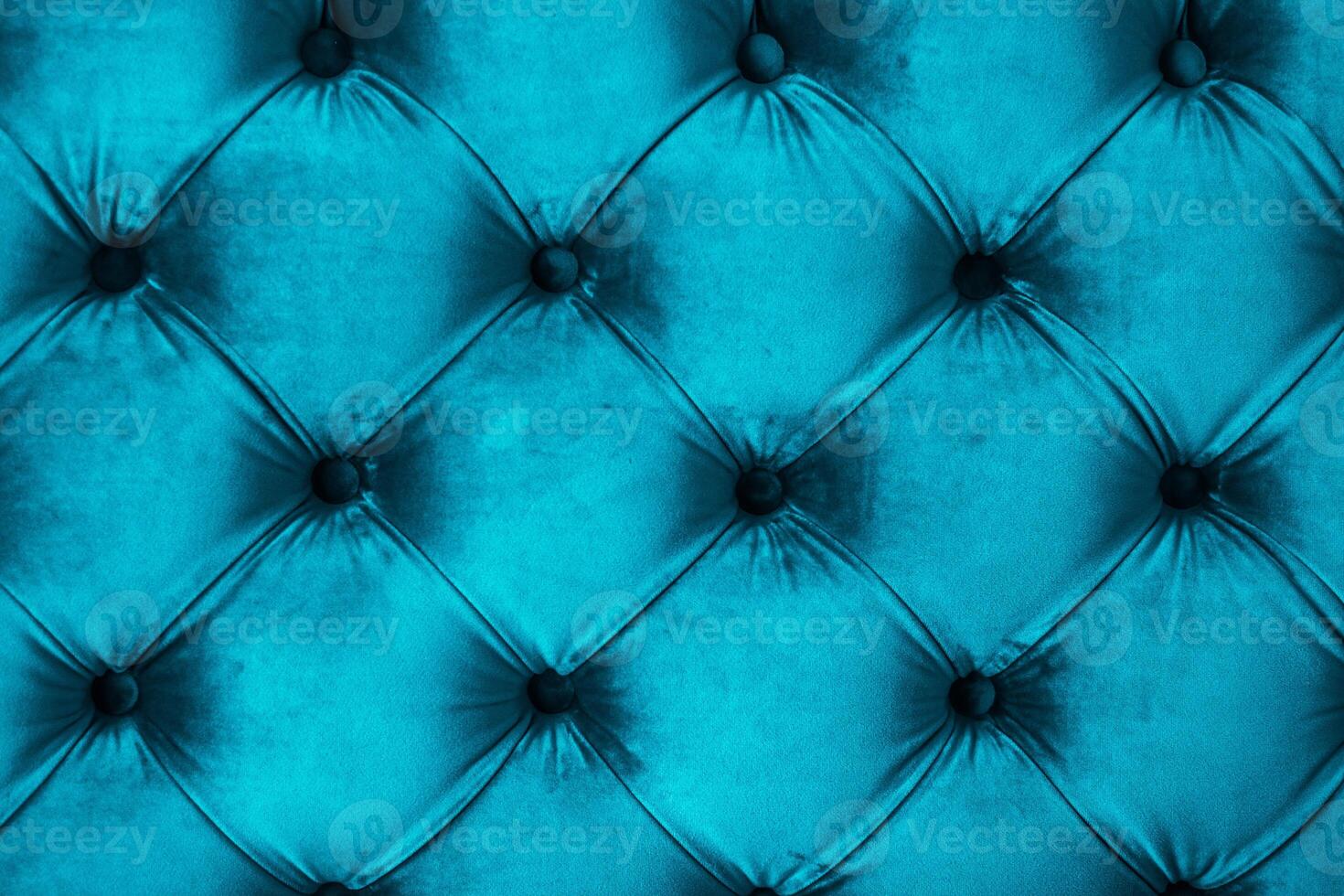 Blue luxury velour quilted sofa upholstery with buttons, elegant home decor texture and background photo