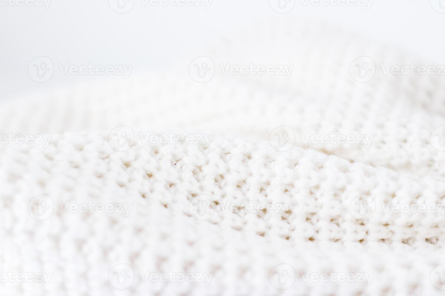 Warm knitted clothes, soft and white photo