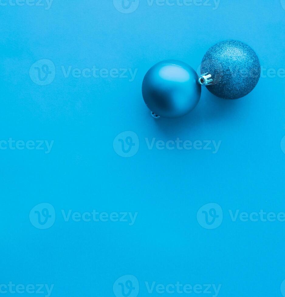 Christmas baubles on blue flatlay backdrop, luxury winter holiday card background photo