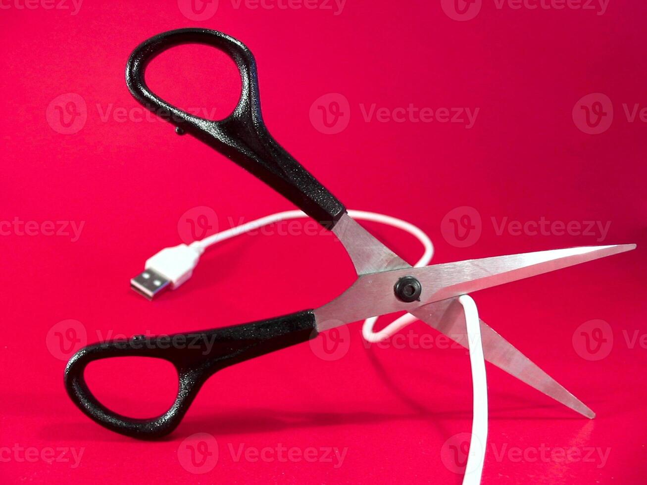 cutting wire with scissors - tech, internet, information and communication styled concept photo